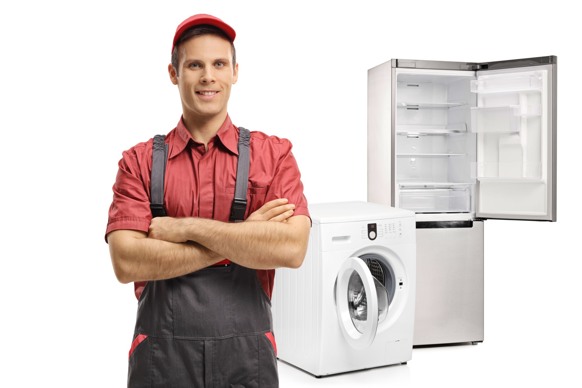 Repairman with his arms folded in front of a washing machine and a refrigerator